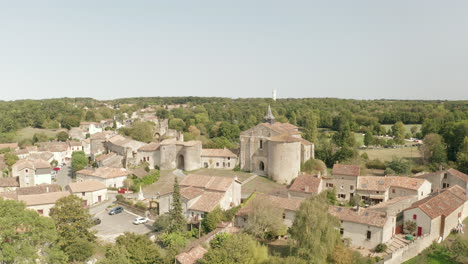 aerial drone point of view of the village and castle of chateau larcher, france