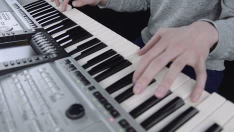 Looking-over-the-piano-as-a-man-plays-some-good-music