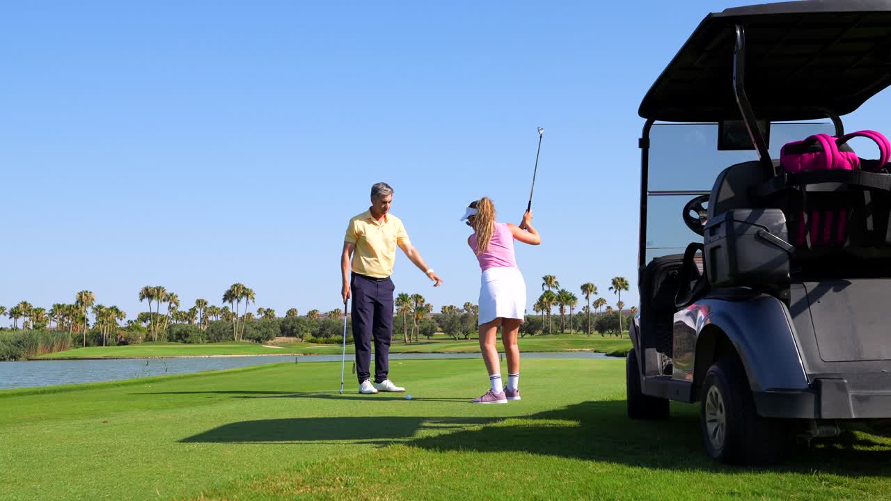 Golf lesson on a sunny golf course