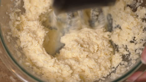 Whipping-butter-with-other-ingredients-to-make-cake-batter-homemade-from-scratch