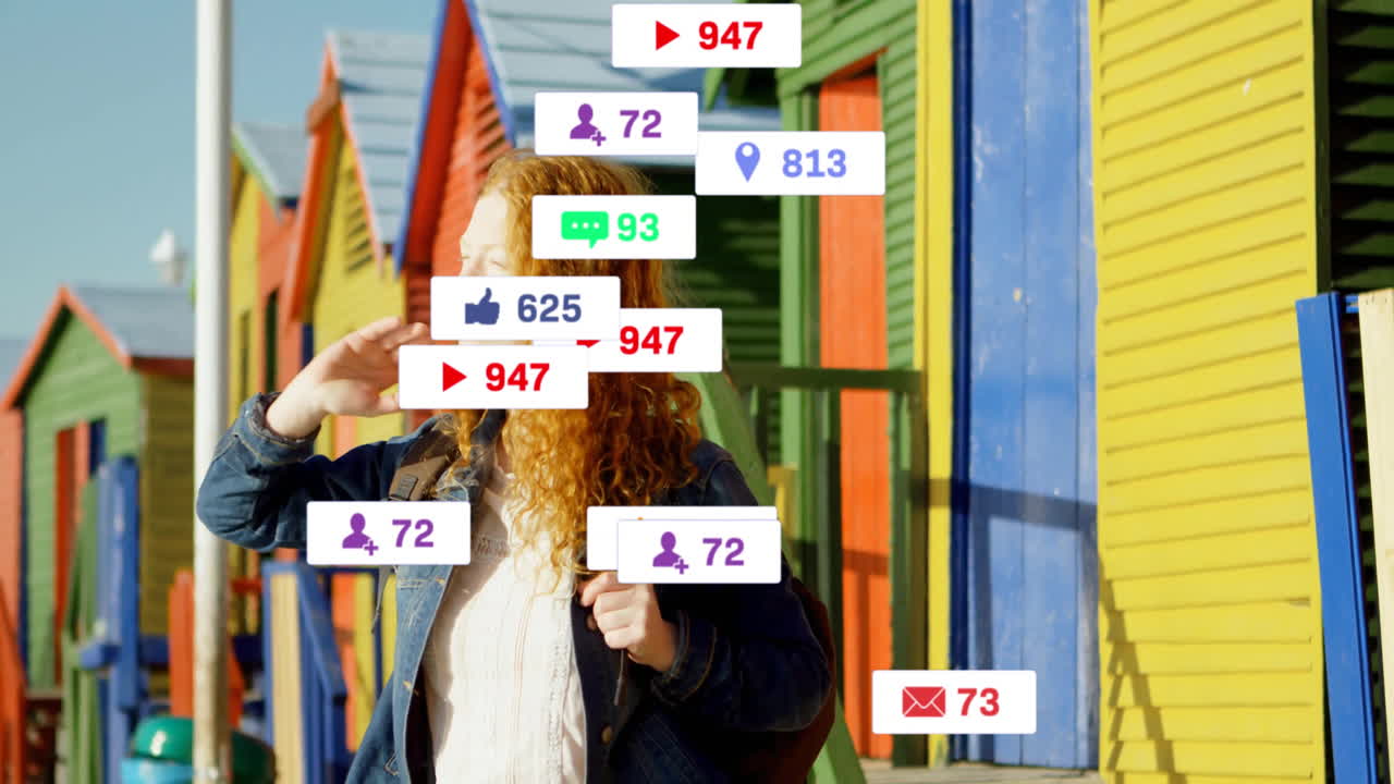 Sunlight bathing woman with animation of social media notifications near beach huts