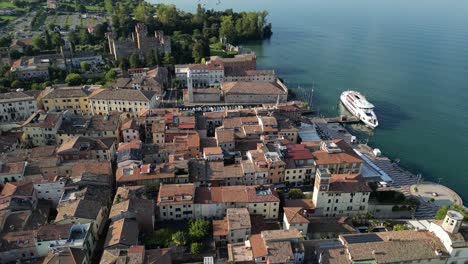 Drone-footage-of-beautiful-Italian-villa-on-the-water-near-a-luxury-yacht