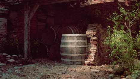 old, wooden barrel in front of a brick wall, in an abandoned or ruined building