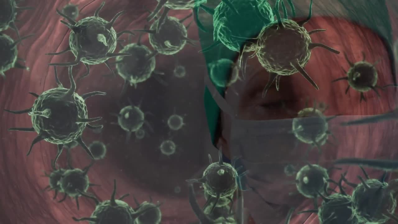 animación de las células de covid-19 flotando sobre el cirujano en la máscara facial