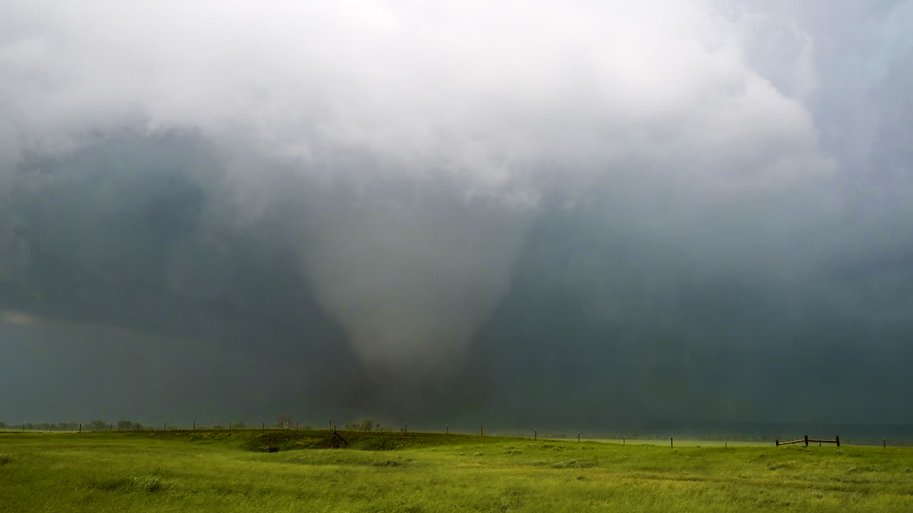 Massive Tornado Approaching a Green Field