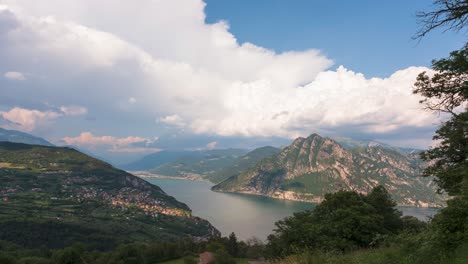 timelpase at lake iseo and mount corna trentapassi at sunny day with clouds