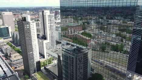 aerial view of amsterdam city center with skyscrapers and reflections