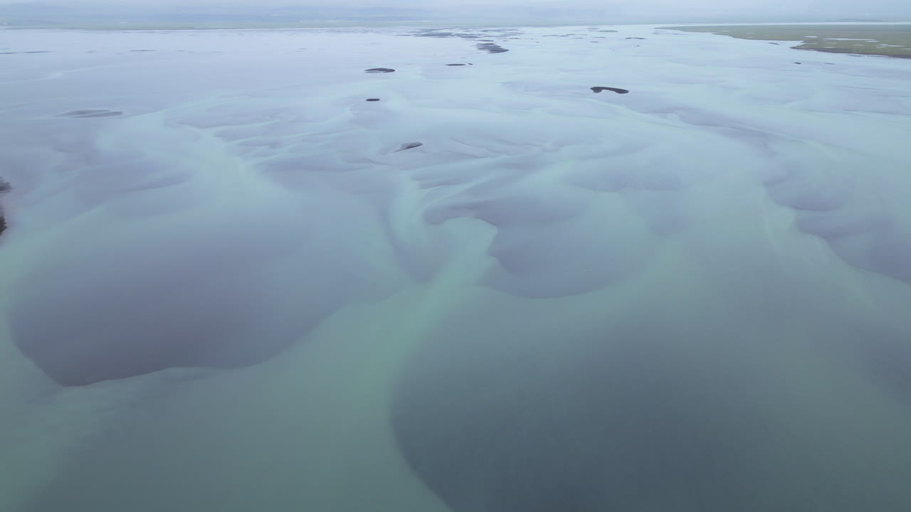 Aerial view of braided glacier river in Iceland, peaceful and vast landscape