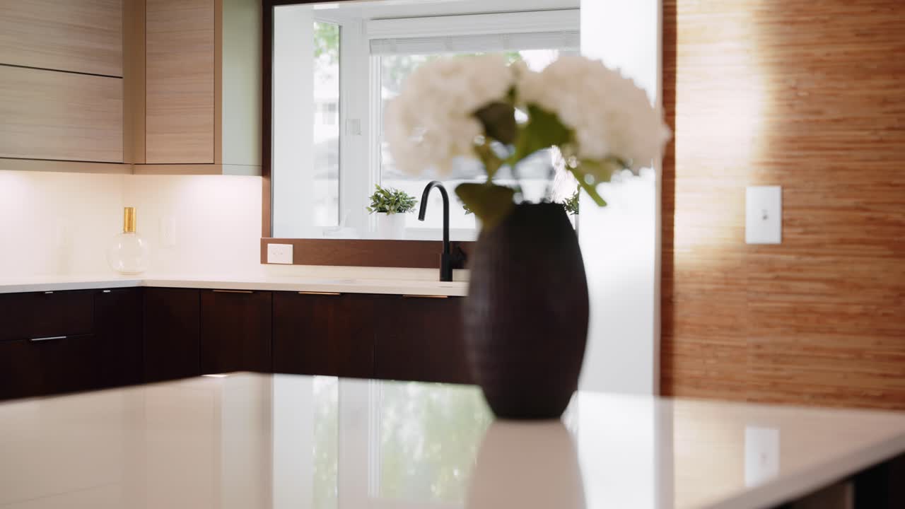 Modern Kitchen Design with Dark Cabinets and White Countertops