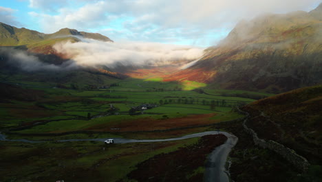 shadowed mountain pass and valley with camera pan up