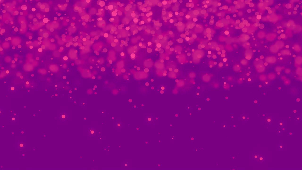 manchas rosadas brillantes que se mueven contra un fondo púrpura