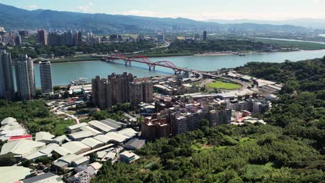 aerial shot of longyuan village and guandu bridge, taipei