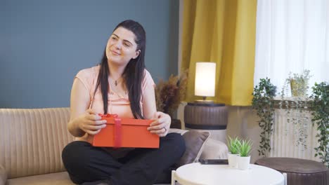 woman waiting for someone with gift box.