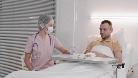 nurse bringing dinner to patient