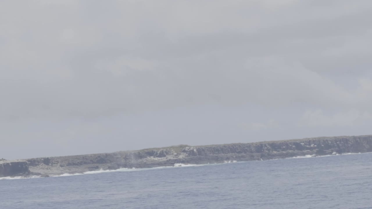 Looking at Espanola island from a cruise in the Galapagos Islands. Slow motion of the El Soplador, a touristic view point of the island.