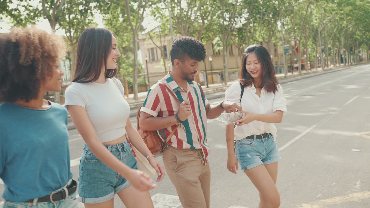 Group of friends crossing the street on a sunny day