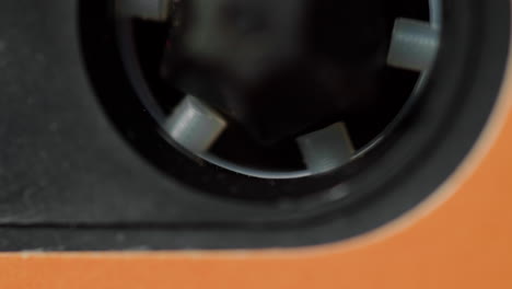 close-up of an audio cassette tape mechanism