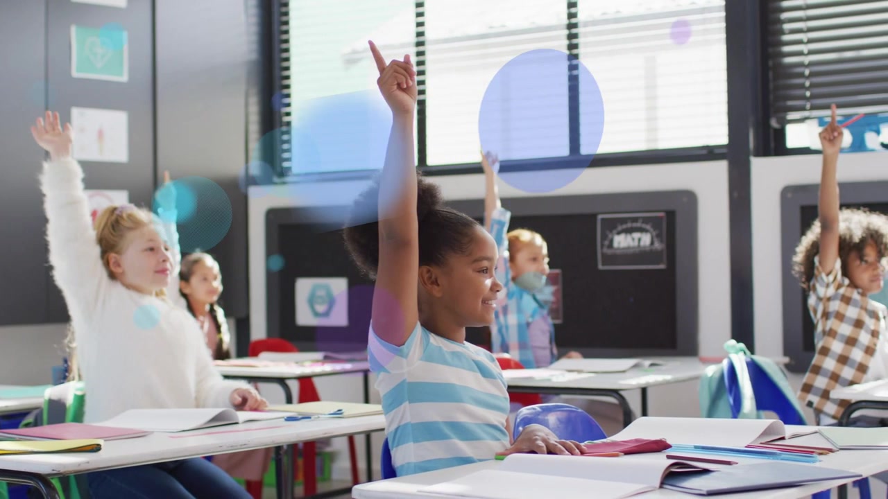 Front-right girl raising hand on teacher cue in classroom, blue or purple circles appearing over des