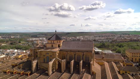 beautiful view over mezquita in cordoba from above with spanish countryside in distance