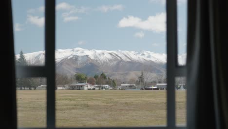 Football-field-of-Twizel,-New-Zealand-viewed-from-inside-house