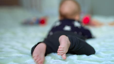 baby lying on a bed