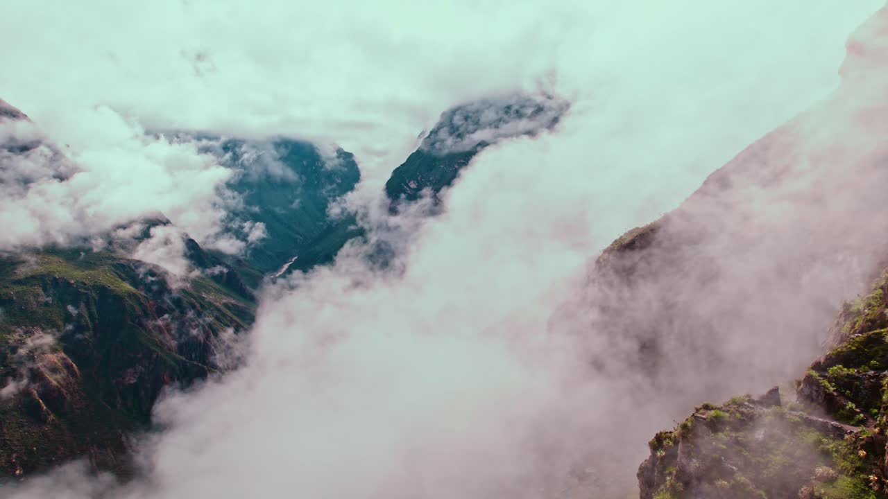 Dramatic drone flight unveils Colca Canyon's depth amid post-rain clouds