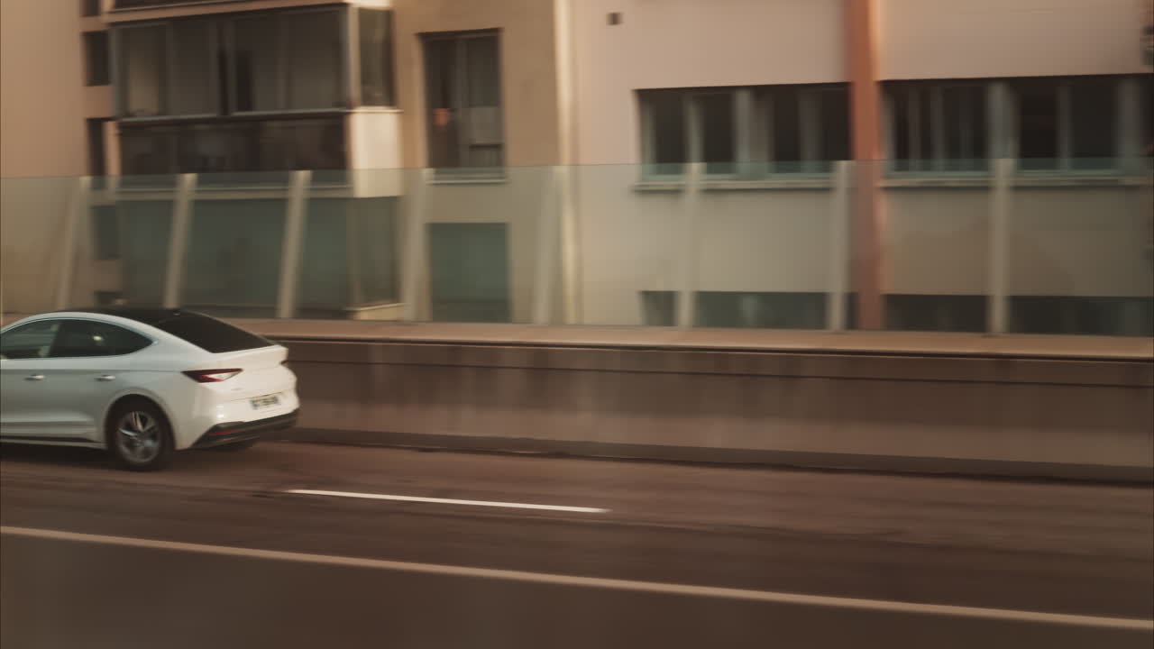 Nice, France - November 24, 2024: View from a moving train of cars moving on the streets of the city