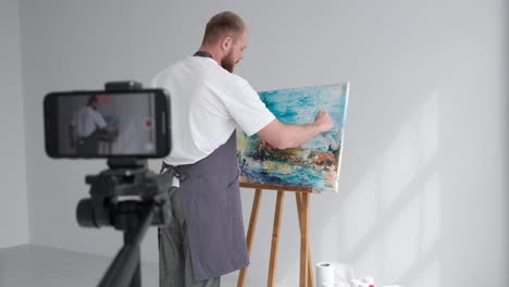 artist vlogging a painting session