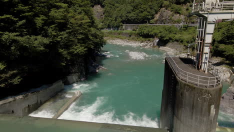 Aerial-Looking-Down-Into-Small-Dam-And-Blue-Green-Water-In-Kochi-Prefecture-On-The-Island-Of-Shikoku,-Japan