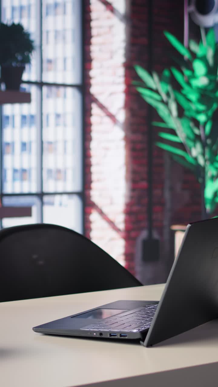 Vertical Video Clean open desk in a luxurious home office loft surrounded by panoramic windows