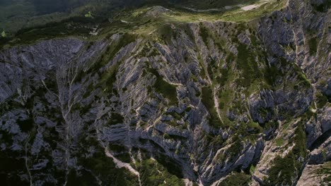 the rugged piatra craiului mountains under bright sunlight, highlighting textures, aerial view