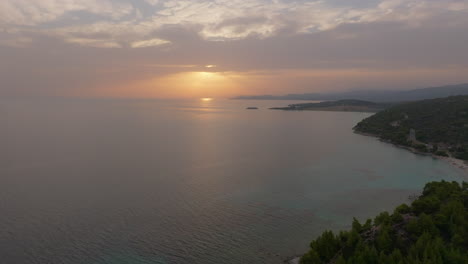 sunset over a calm, turquoise sea