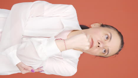 Vertical-video-of-Thoughtful-woman-towards-the-camera.