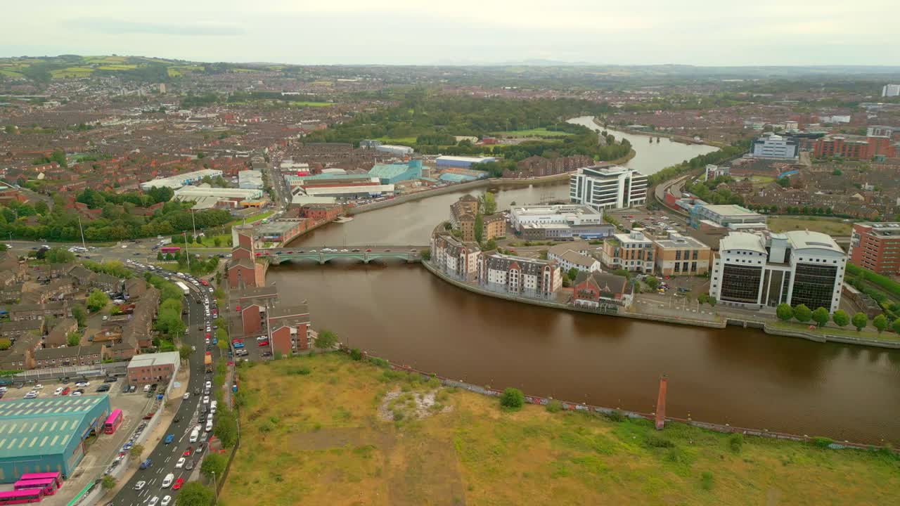 Pull-away 4K aerial video of Queen's Bridge in Belfast City centre on a bright and sunny afternoon. Produced in 4K, 60FPS and with Rec709 color