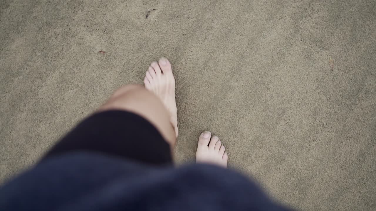 Walking barefoot on the sand