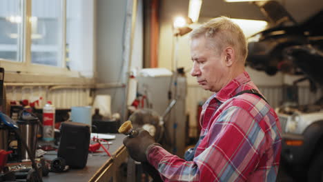 mechanic inspecting a brush