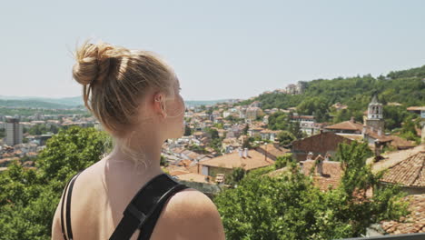 travel hungry tourist overlooks historic city of veliko tarnovo bulgaria