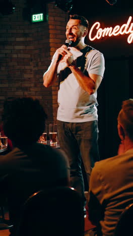 comedian on stage at comedy club
