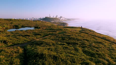 Beautiful-aerial-view-on-top-of-cliffs-on-atlantic-ocean-in-the-morning-sunrise,-Conservation-Unit-located-in-Brazil