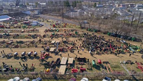 an aerial view of an amish mud sale in pennsylvania selling amish products on a sunny day