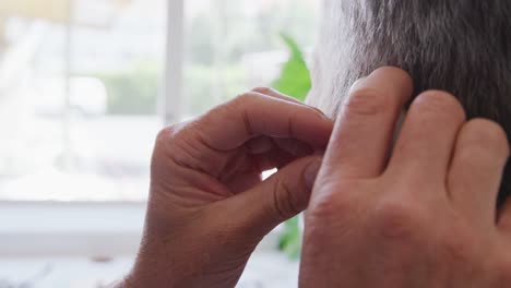 doctor examining a senior woman in a retirement home