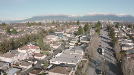 stunning aerial view over vancouver with the north shore mountains towering in the distance