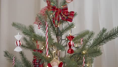 decorated christmas tree with red and white ornaments