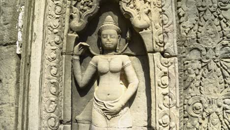 khmer temple bas-relief stone artwork of apsara dancer in angkor wat complex in siem reap, cambodia