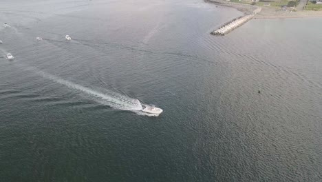 Birds-eye-view-of-a-boat-on-water,-going-over-the-ocean