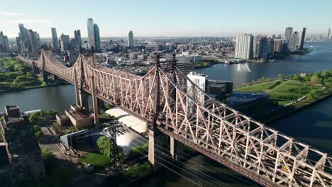 Crispy-aerial-of-NYC's-Queensboro-Bridge,-heading-into-Queens