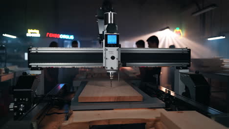 cnc router machine working on wood in a workshop
