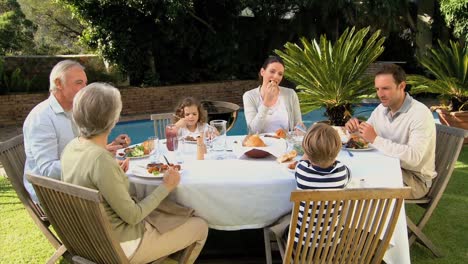 family having lunch in the garden