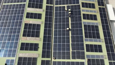 Solar-panels-being-installed-on-factory-rooftop