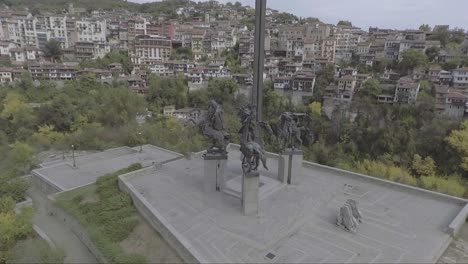 aerial of an old neighborhood of houses and homes near sarajevo mosnia with sculpture in foreground